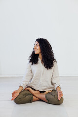 beautiful woman brunette engaged in yoga asana gymnastics exercises