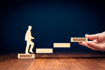 Change mindset lead to be successful. Concept with wooden pieces of blocks and person representing soar to success. Helping hand of coach, mentor or another motivating person. - obrazy, fototapety, plakaty