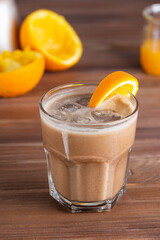 Mocca coffee with orange and coconut milk in a glass. Sugar, gluten and lactose free.