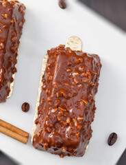 cake with peanuts poured with chocolate c