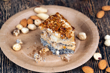 sweet cake with buttercream and sponge cake and lots of poppy seeds and nuts