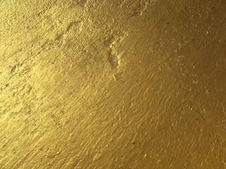 Gold color cement wall texture background abstract 