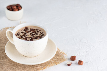 Mocha of coffee with chocolate, hazelnuts and coconut milk in a cup. Sugar, gluten and lactose free.