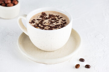 Mocha of coffee with nuts and chocolate in a mug. Sugar, gluten and lactose free.