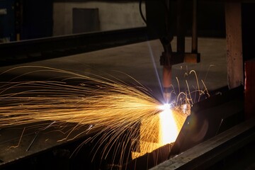 Plasma welding and metal cutting in industry. High-tech production processes at the plant