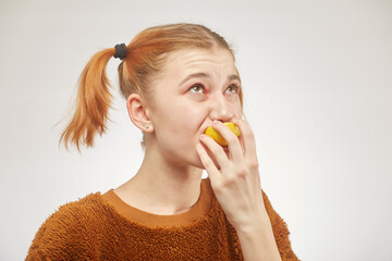 girl eats lemon