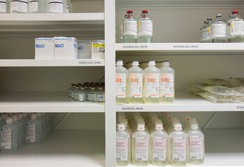 Modern hospital storage facilities, shelves of products for treatment and hospital procedures. 