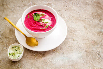 Red vegetarian beet root cream soup with herbal basil salt