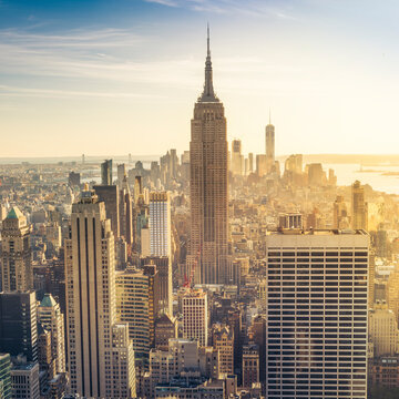 Empire State Building rising above Manhattan skyline.