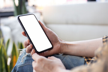 cell phone blank white screen mockup.hand holding texting using mobile on desk at office.background empty space for advertise.work people contact marketing business,technology
