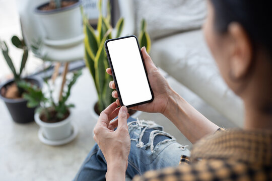 cell phone blank white screen mockup.hand holding texting using mobile on desk at office.background empty space for advertise.work people contact marketing business,technology