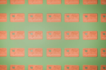 Credit cards arranged side by side on green background