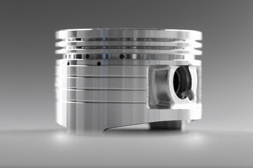 Closeup of white piston auto repair part