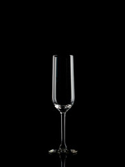 
wine and champagne glass on black background with pouring red wine
