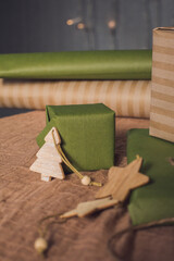 Christmas gifts in green and brown kravtovoy packaging. Gift wrapping. Christmas shopping