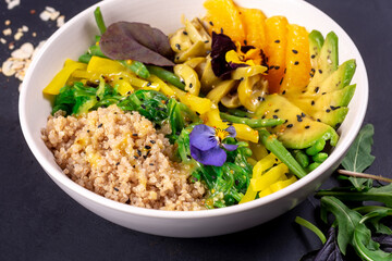 Bowl healthy salad with chia seeds. Close up on black background
