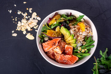 Bowl healthy salad with salmon top view