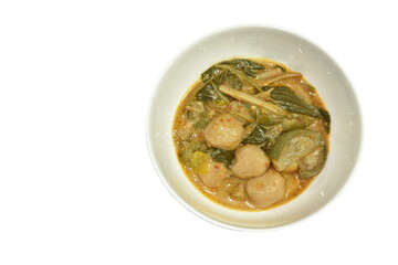 spicy boiled fish ball with slice eggplant in coconut milk green curry soup on bowl
