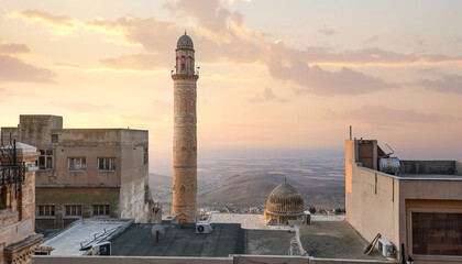 Fototapeta na wymiar The Old city of Mardin, Turkey at sunrise. Cityscape view to the minaret of the Grand mosque