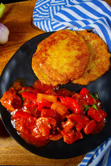 Original Hungarian goulash with potato pancakes