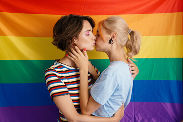 White lesbian couple hugging and kissing together - obrazy, fototapety, plakaty
