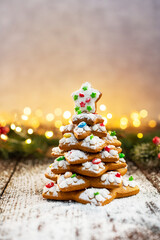 Homemade Gingerbread cookies Christmas Trees, decorated with icing and sugar decorations.
