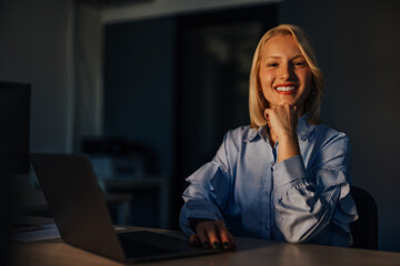 Portrait of satisfied caucasian woman, taking a short break from work.