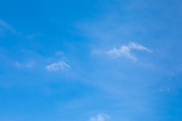 Fototapeta premium Blue sky background with white clouds.
