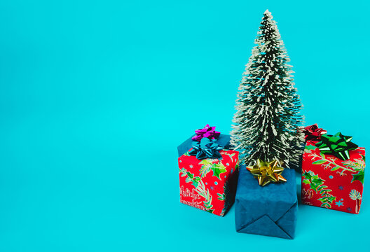 Christmas tree with gifts on a blue background