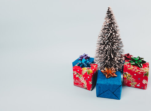 Christmas tree with gifts on white background