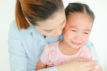 crying little girl being consoled by single mom