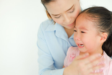 crying little girl being consoled by single mom