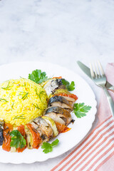 Baked mackerel with vegetables. Ready-made seafood dish.