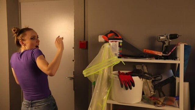 A sweet girl entered the closet and looks around.