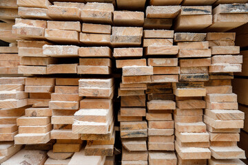 Sale of pine boards intended for construction. Warehouse wood bars boards.