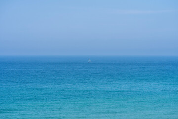 Minimalist yacht in the sea on a clear day