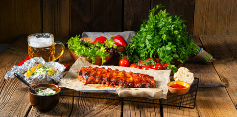 spicy spare ribs with baked potatoes and sour cream - obrazy, fototapety, plakaty