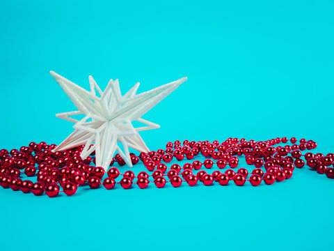 Christmas snowflake with decorations on a blue background