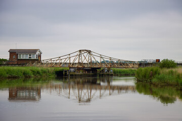 Somerleyton railway swing bridge reflection in water, Suffolk