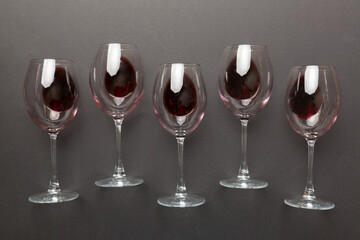 Many glasses of red wine at wine tasting. Concept of red wine on colored background. Top view, flat lay design