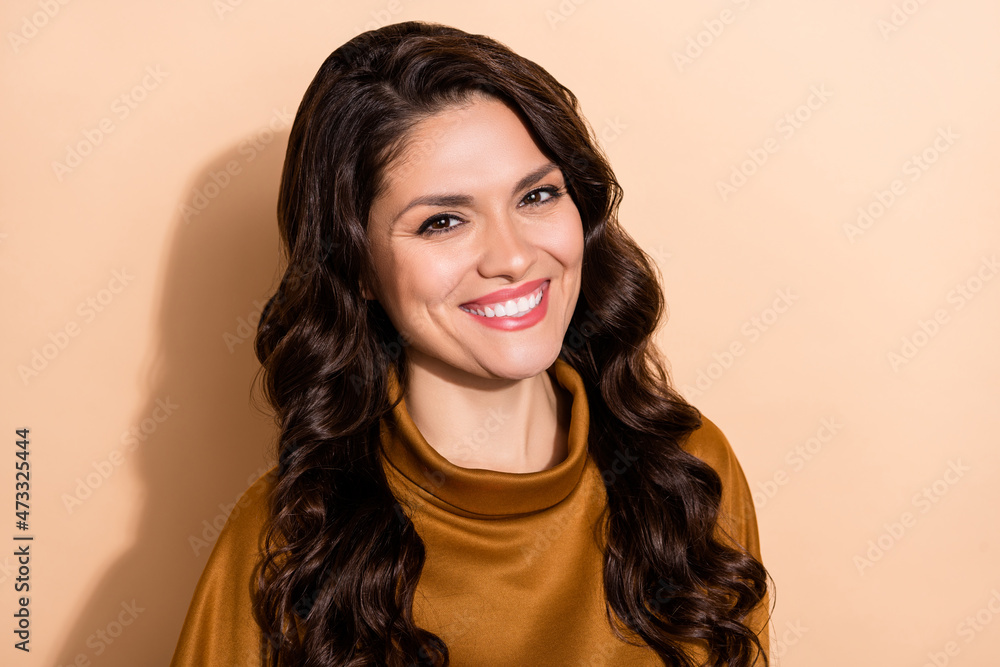 Sticker Portrait of attractive content cheerful wavy-haired woman good mood isolated over beige pastel color background