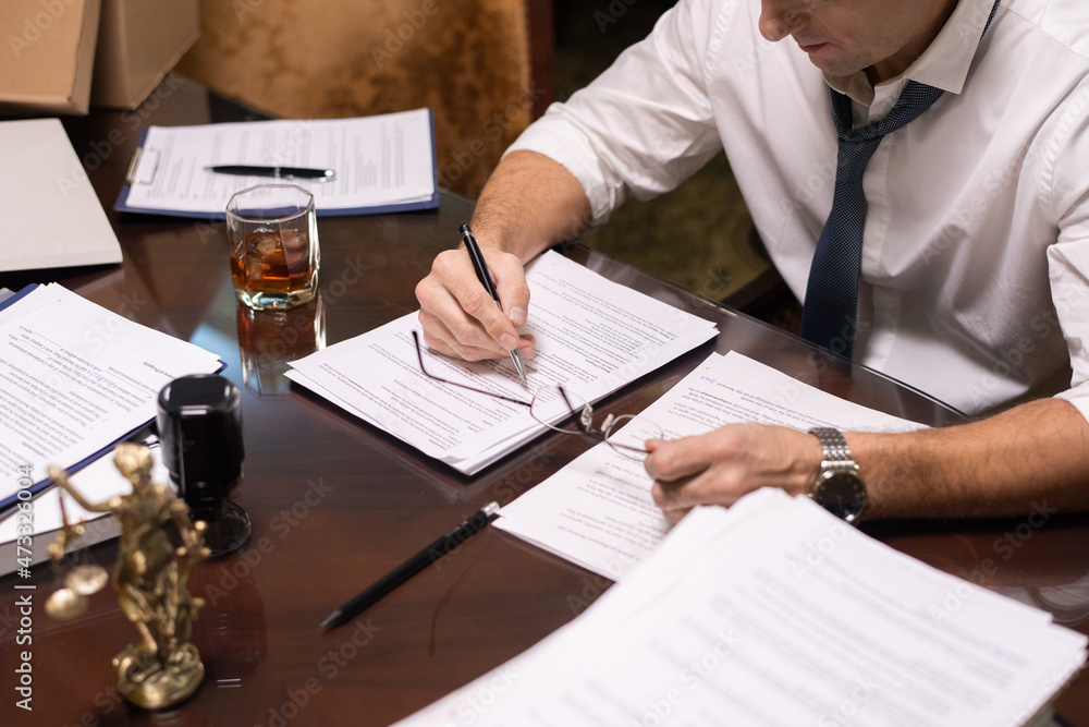 Aufkleber hands of serious mature businessman pointing at contract while reading it before signing and putting