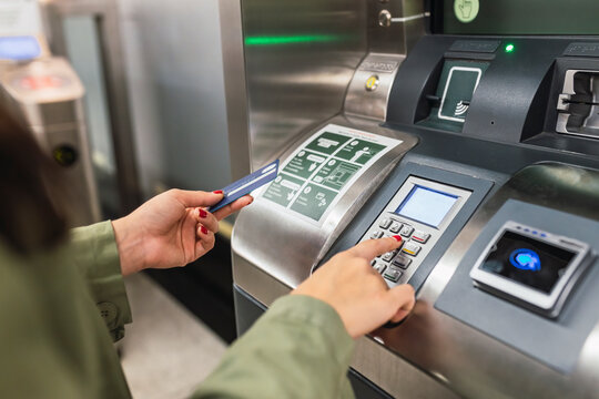 Woman making payment through smart card in subway