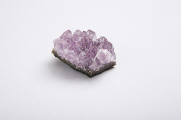 Druse amethyst crystals on gray background