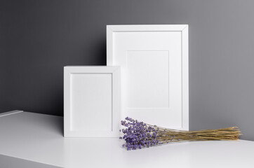 Blank vertical frames mockup for photo, print or artwork presentation with lavender flowers over...