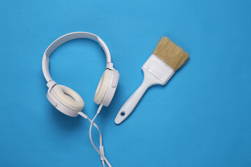 Brush with headphones on a blue background