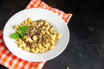 lentil pasta cavatappi bean legumes second course healthy meal diet snack on the table copy space food background rustic. keto or paleo diet veggie vegan or vegetarian food no meat
