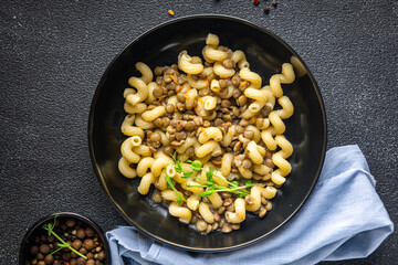lentil pasta cavatappi bean legumes second course healthy meal diet snack on the table copy space food background rustic. keto or paleo diet veggie vegan or vegetarian food no meat
