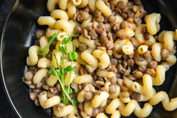 lentil pasta cavatappi bean legumes second course healthy meal diet snack on the table copy space food background rustic. keto or paleo diet veggie vegan or vegetarian food no meat