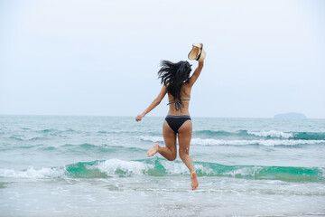 sexy asia woman wearing bikini on the beach